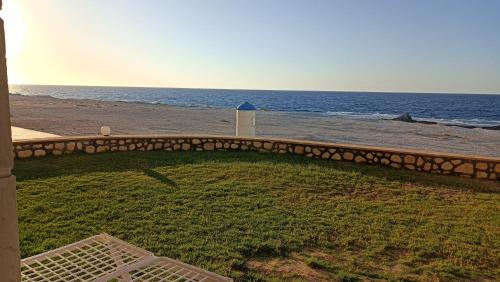 a view of the beach from the balcony of a house at شالية للايجار اليومي ثلاث غرف مكيف 2حمام d01 مرسى مطروح "family" in Marsa Matruh