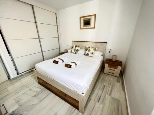 Posteľ alebo postele v izbe v ubytovaní PUSHE Playa Granada Beach&Golf 7