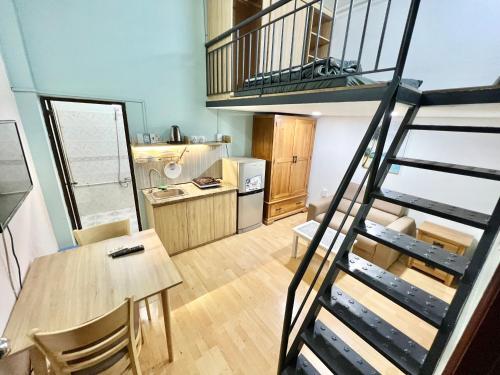 A kitchen or kitchenette at Halo Serviced Apartment