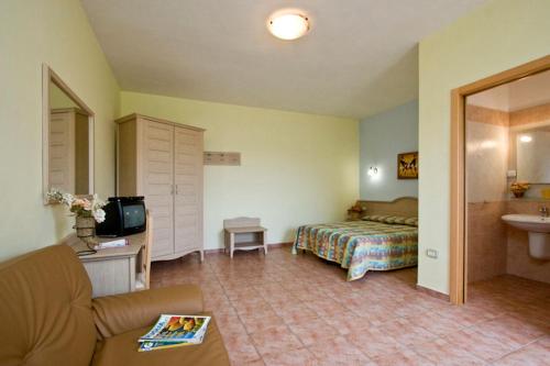 Ένα ή περισσότερα κρεβάτια σε δωμάτιο στο Il Gelso Bianco