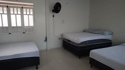 Ένα ή περισσότερα κρεβάτια σε δωμάτιο στο Casa perto do Centro