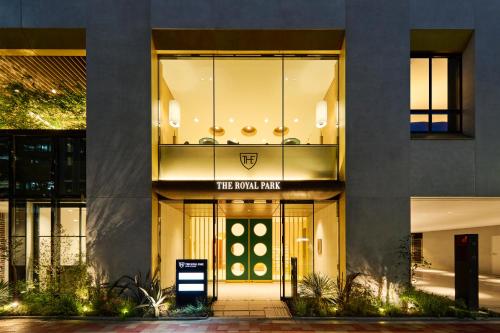 a building with a front entry with a sign on it at The Royal Park Hotel Ginza 6-Chome in Tokyo