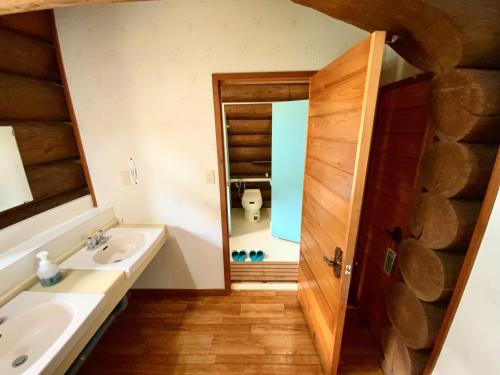 a bathroom with a sink and a toilet at Mashuko Youth Hostel - Vacation STAY 01026v in Teshikaga