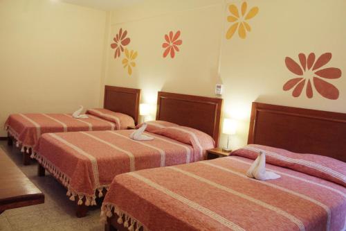 Кровать или кровати в номере Hotel Florida Oaxaca