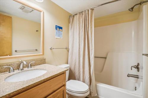 a bathroom with a sink and a toilet and a shower at Pinnacle B04 in Killington
