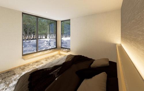 Кровать или кровати в номере Hakuba Amber Resort by Jade Group
