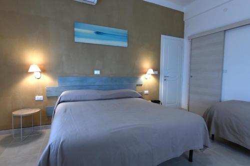 Postel nebo postele na pokoji v ubytování Hotel La Tavernetta