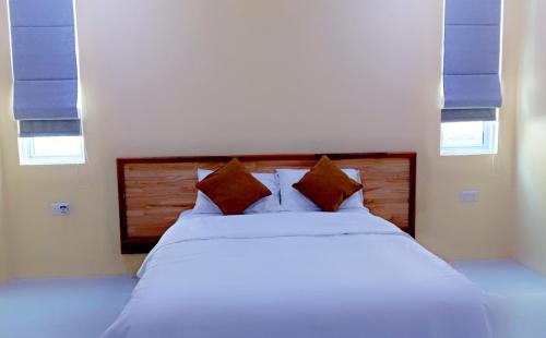 Postel nebo postele na pokoji v ubytování Island life Home Stay