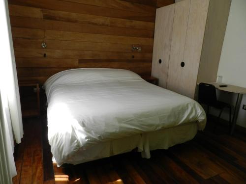 Una cama o camas en una habitación de Aroma Verde Hotel