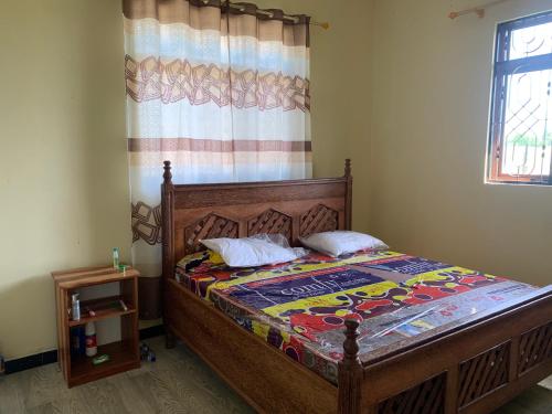 Katil atau katil-katil dalam bilik di Kae Holiday Home