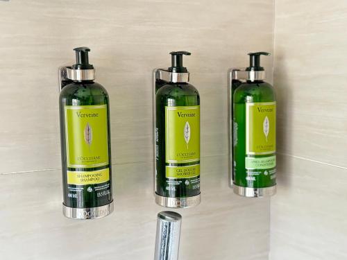 three green bottles sitting on a wall at Grand Cosmos Resort Ruisui Hualien in Ruisui
