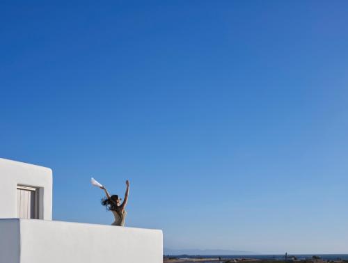 two people standing on top of a building at Maestro Villas Naxos in Naxos Chora