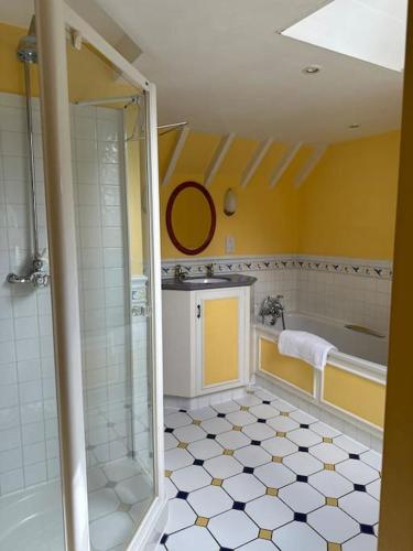 a bathroom with a shower and a sink at Garden Cottage in Henley on Thames