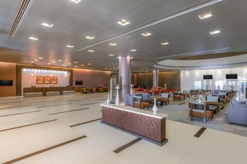 a rendering of the lobby of a hotel at Four Points by Sheraton Al Ain in Al Ain
