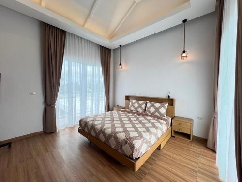 Postel nebo postele na pokoji v ubytování M2H Poolvilla Cha-am