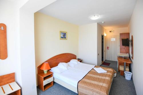 Postel nebo postele na pokoji v ubytování Hotel Rio