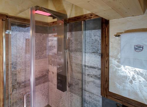 a shower with a glass door in a bathroom at Francois Boutique Rooms - Matterhorn Retreat & SPA in Cervinia in Breuil-Cervinia