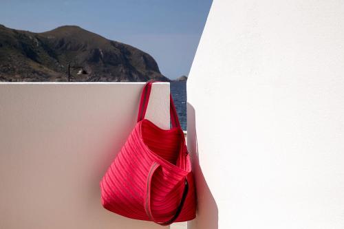 a red rope sitting on the side of a wall at Residence Scirocco e Tramontana in Favignana