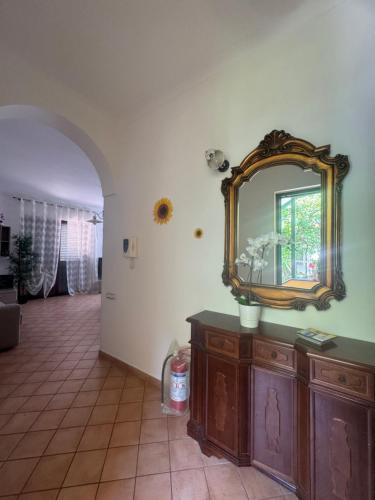 a mirror on top of a dresser in a room at Villa Girasole Luxury Amalfi Coast in Minori