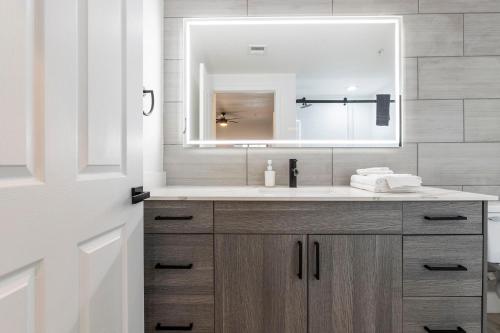 a bathroom with a sink and a mirror at 3BR CozySuites at Kierland Commons with pool #12 in Scottsdale