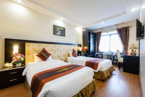 Ένα ή περισσότερα κρεβάτια σε δωμάτιο στο Diamond Hotel