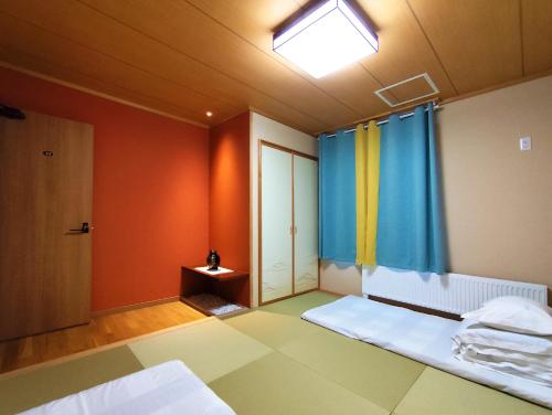 Cama o camas de una habitación en White House Guesthouse