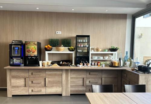 a kitchen with a counter with a coffee maker at B&B HOTEL Antibes Juan-les-Pins in Juan-les-Pins