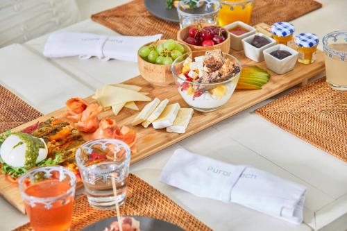 a table with a buffet of food and drinks at Tivoli Portopiccolo Sistiana Apartments in Sistiana