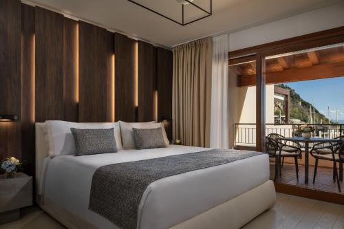 Postel nebo postele na pokoji v ubytování Tivoli Portopiccolo Sistiana Apartments