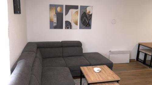 a living room with a couch and a table at Kuća za odmor GAVRIĆ in Mrkonjić Grad