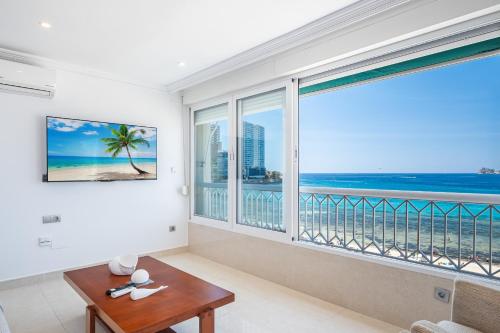 a living room with a view of the ocean at Torre Principado 5-E Apartment Levante Beach in Benidorm