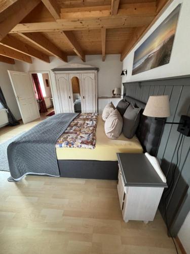 a bedroom with a large bed in a room at Gemütliches Landhaus in ruhiger Lage. in Moringen