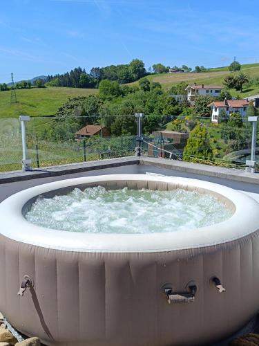 a large circular hot tub with water in it at Plena naturaleza en Pleno San Sebastián in Donostia-San Sebastián