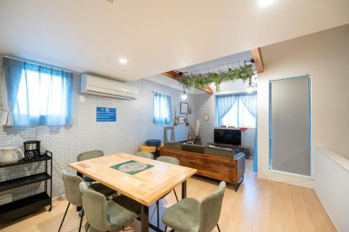 a dining room with a table and chairs at trive osu east 最大7名宿泊可能 in Nagoya