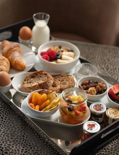 a tray of breakfast foods on a table at Hotel Sole in Cannero Riviera