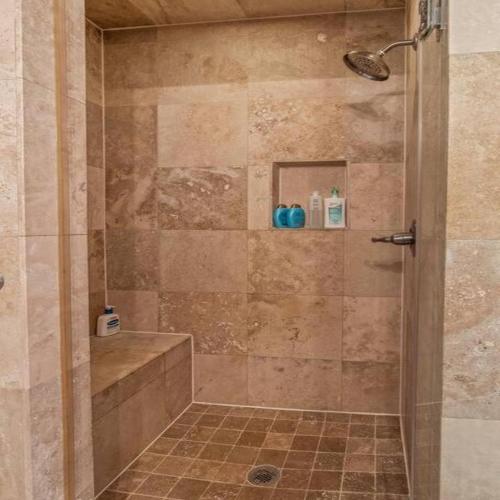 a shower with a glass door in a bathroom at Bright & Modern Home with Patio in Philadelphia
