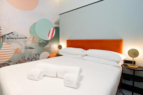 Łóżko lub łóżka w pokoju w obiekcie Amor de Dios 17 Boutique Apartments