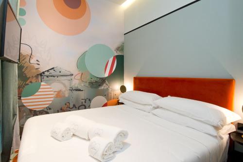 Łóżko lub łóżka w pokoju w obiekcie Amor de Dios 17 Boutique Apartments