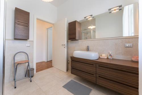 a bathroom with a sink and a mirror at Casa Del Marchese With Private Pool, Castell’arqua in Vigostano