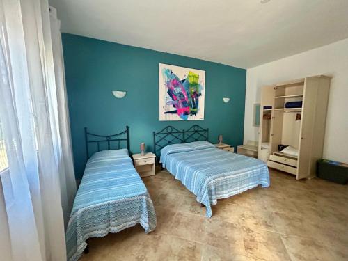 Postel nebo postele na pokoji v ubytování L'oasi Una Pineta Sul Mare