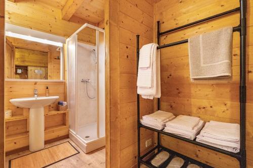 a bathroom with a shower and a sink and a toilet at Wunderchalet in Daone
