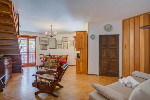 a living room with a couch and a table at Il Rododendro City Center - Happy Rentals in Bardonecchia