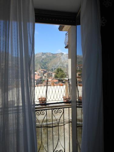 a room with a window with a view of a mountain at Al Palmento in Galati Mamertino