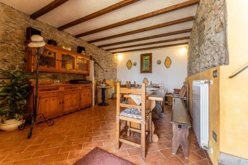 a kitchen with a table and a dining room at La Casa Di Elda, Holiday Home With Pool, Uzzano, Toscana in Uzzano