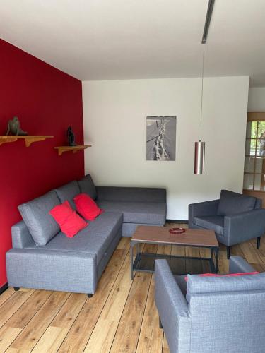 a living room with two couches and a table at Ferienhof Kröger in Bielefeld