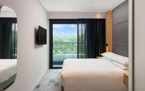 Postel nebo postele na pokoji v ubytování Hilton Port Moresby Hotel & Residences