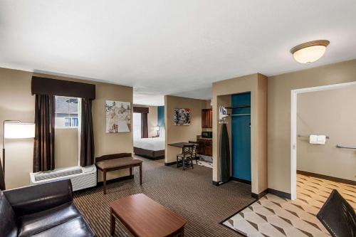 a living room with a couch and a bed at The Hotel Saratoga, an Ascend Collection Hotel in Saratoga Springs