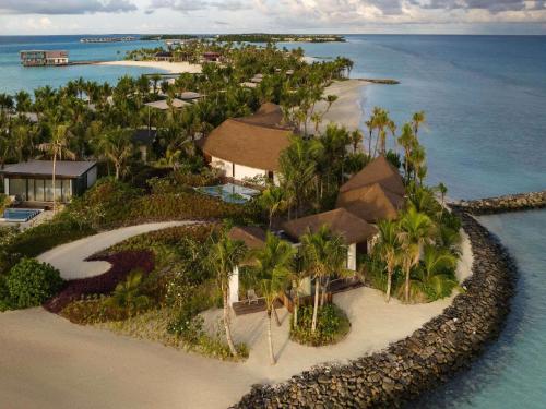 an aerial view of a resort in the ocean at SO/ Maldives in South Male Atoll
