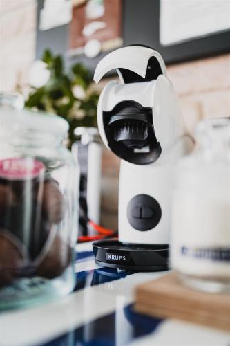 a blender sitting on top of a counter at Butique Apartman Grand in Balatonlelle