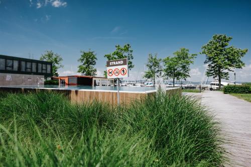 a speed limit sign in the middle of a road at Butique Apartman Grand in Balatonlelle